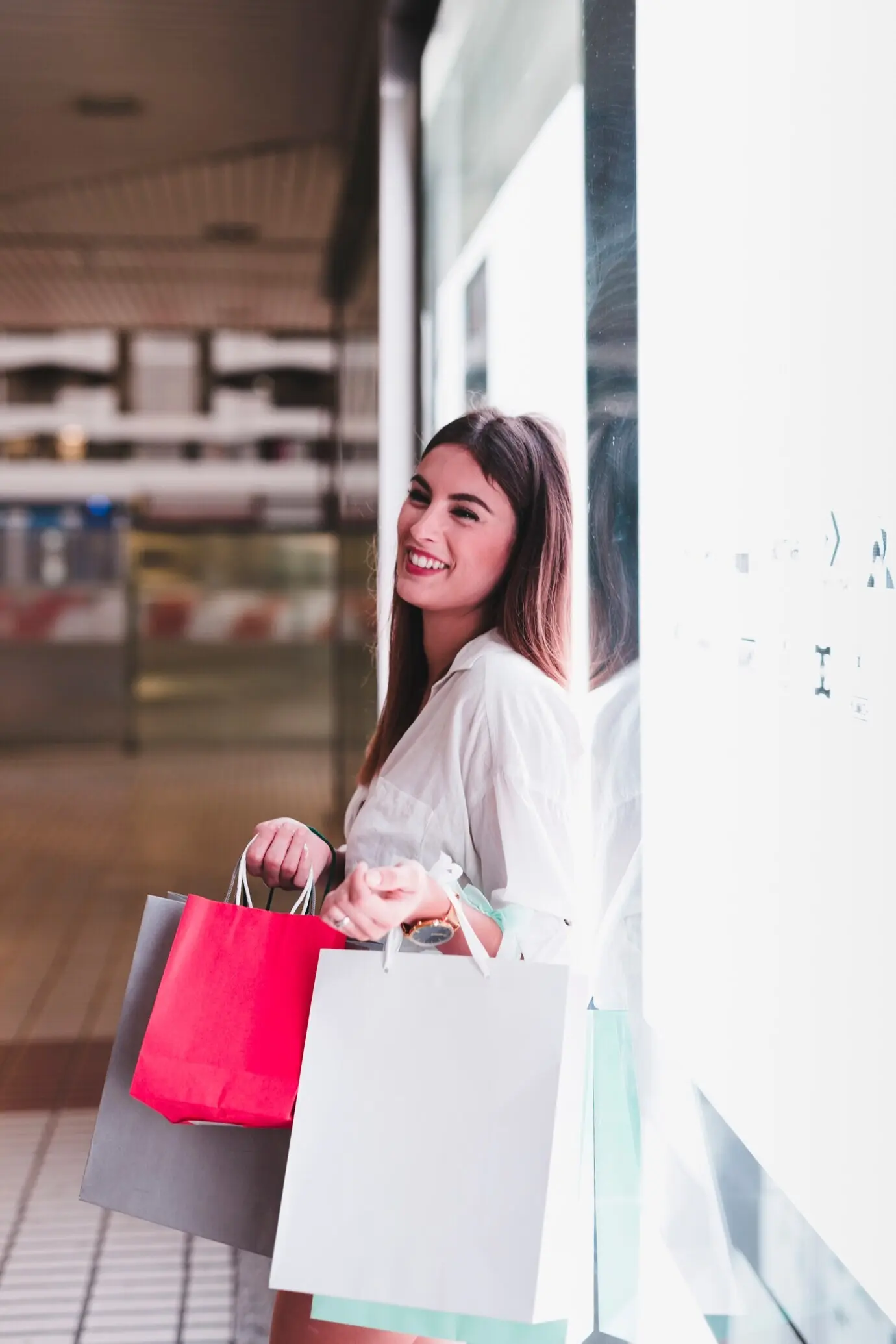 A girl shopping and carrying bags